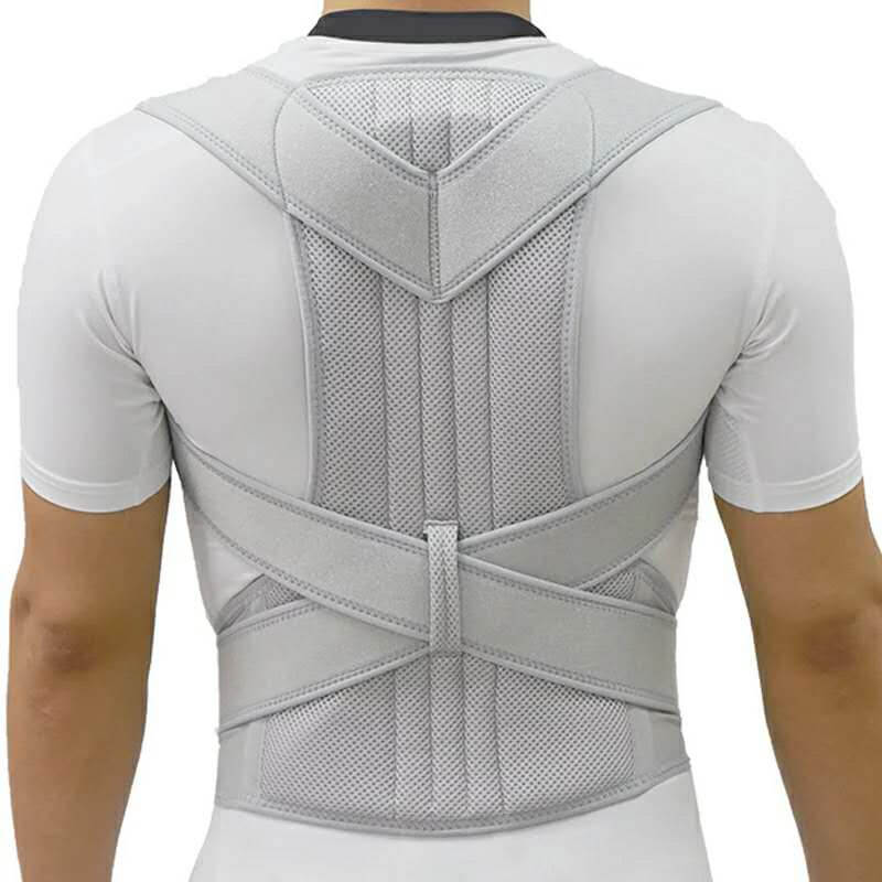 Adjustable posture corrector brace for back and shoulder support worn by man in white shirt